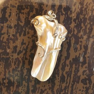 A Gilded Mother of Pearl Pendant